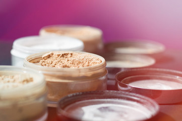 Background with mineral make up powder. Products for make up foundation and matt skin