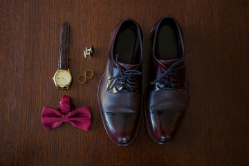 Fototapeta na wymiar Set groom Butterfly shoes Belts Cufflinks Watches Men's Accessories