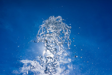 Stream of water divided into droplets