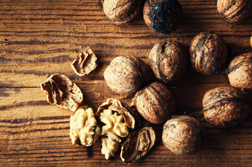 Walnuts on wooden background. Copyspace