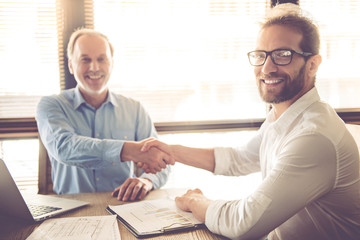 Fototapeta premium Two handsome businessmen working