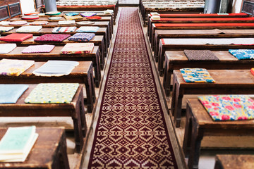 Cushions on empty church benches