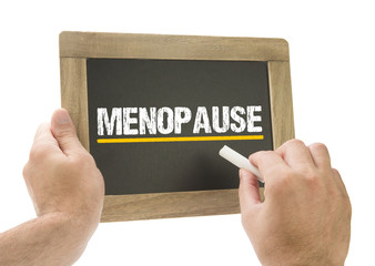 Menopause - Hand schreibt auf Kreidetafel