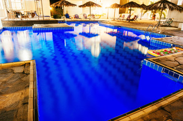 Swimming pool illuminated at night