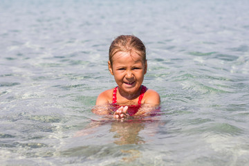 Fototapeta na wymiar Little Girl Swimming Summer