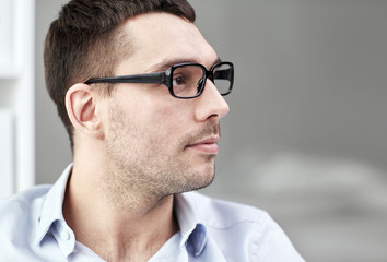 Obraz premium portrait of businessman in eyeglasses at office