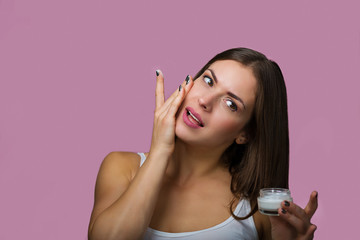 Obraz premium Woman with a skin care product