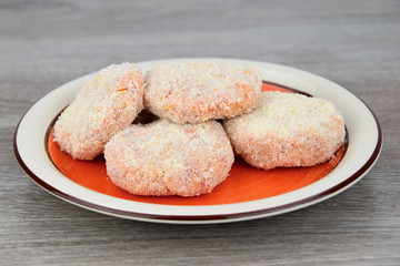 Meat patties on a plate.