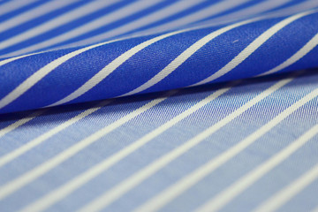 close up roll blue and white fabric of shirt