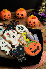 Creepy Halloween cookies and pumpkin baskets filled with candies