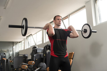 Healthy Man Doing Exercise Barbell Squat