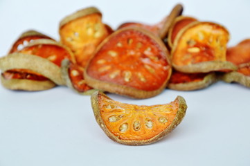 dried bael fruit on white background