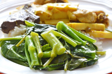 stir fried Chinese kale and spicy chicken with bamboo shoot curry on rice