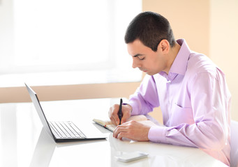 Business man working with documents and laptop