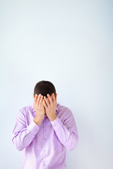 Portrait of business man closed face by two hands