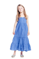 Full length portrait of cute little girl in blue dress. Isolated on white.