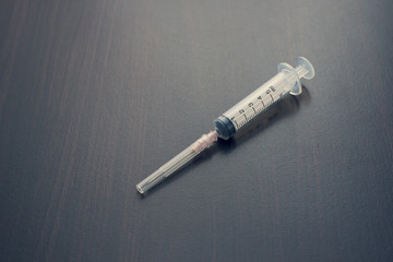 Close up syringe on the table