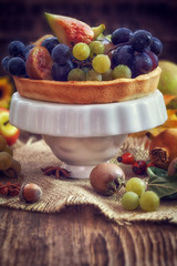 Autumn concept - Autumn fresh fruit on wooden background with copy space 