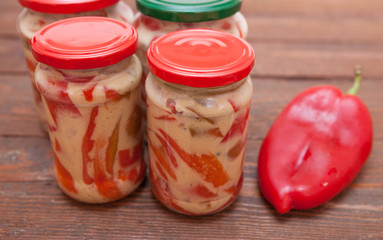 Red paprika with mustard in bottle