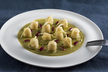velvety green peas with dumpling, lemon and radicchio