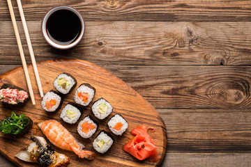 Sushi and rolls set served on board