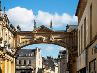 Fototapeta na wymiar Arch over the Road by the Roman Baths and Pump Room in Bath