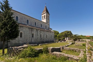 Fototapeta na wymiar Church of St. Stephen and ruins of old church in Grohote, village on island Solta in Croatia
