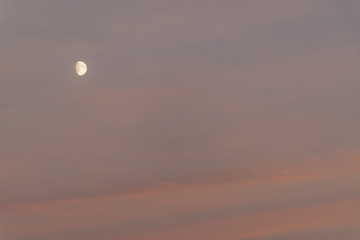 the moon at sunset