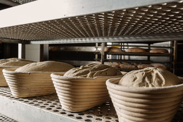 Raw leavened breads prepared on the rack before placing in the oven.