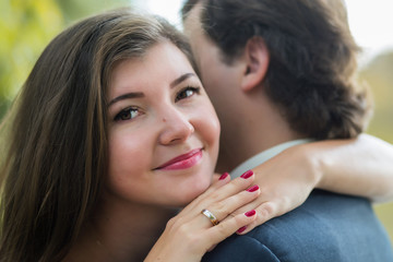 Groom sneaks a kiss on bride's cheek