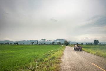 Countryside landscape road with old vehicle