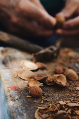 cracking almonds with a hammer