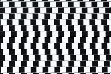 Lines are parallel but seem to be slanted - optical illusion.