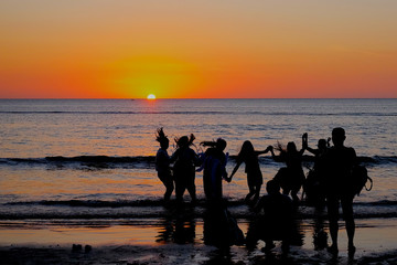 People Enjoying Seaside Sunset