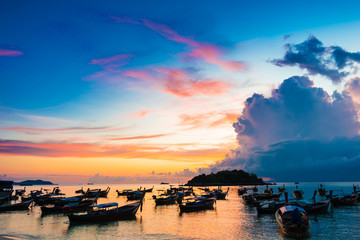 Reflection of Wooden Boat with Burning Sky During Sunrise