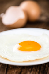 Wooden table with Fried Eggs (selective focus)