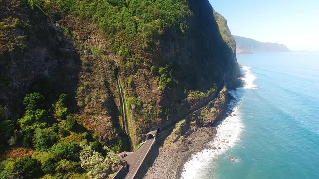 aerial view of waterfall and ocean in Madeira island
