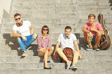 Fototapeta premium Happy friends hanging out on stairs
