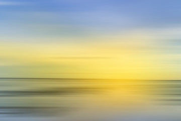 abstract scene of motion blur sea with sun light yellow