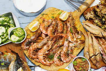 Grilled shrimps on wooden table.