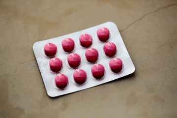 Red tablets in blister pack