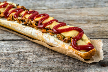 Crispy sandwich with cheese and mushrooms, open faced baguette