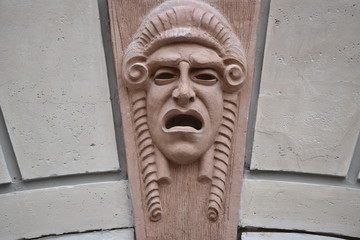 Architectural elements depicting theater mask, Ascoli Piceno, Italy
