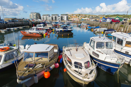 Boats West Bay harbour Dorset uk on a beautiful day with blue sky in summer