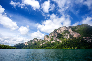 Fototapeta na wymiar environment of mountains and river natural attractions in Ratchaprapha Dam at Khao Sok National Park, Surat Thani Province, Thailand.