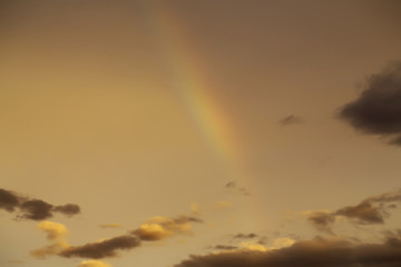 rainbow on dark sunset sky