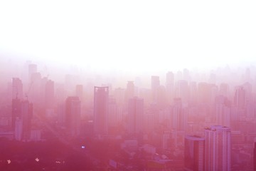 Aerial view of big city at misty sunrise, Bangkok, Thailand