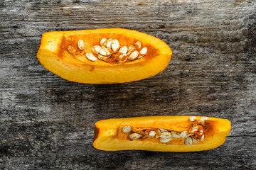 Sliced pumpkin flat lay from above, slices with seeds 