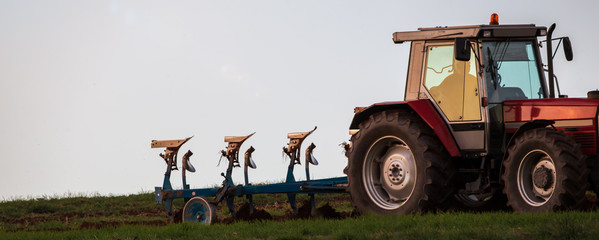 tractor plowing a field