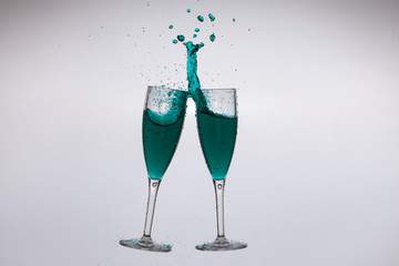 Splash glasses full of green cocktails